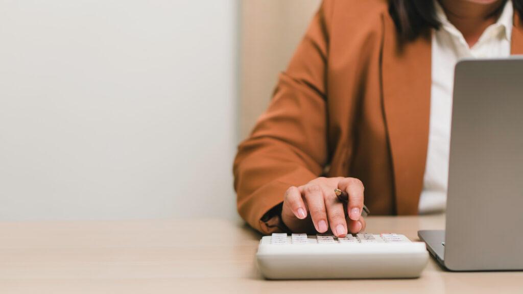 business woman looking at cost optimisation and budgeting