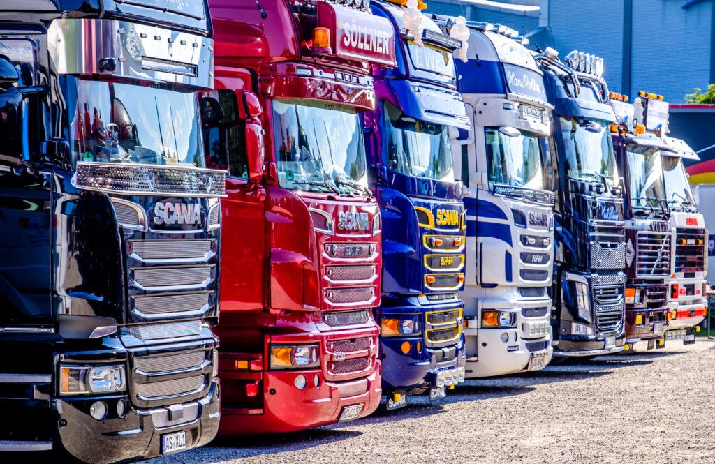 row of scania trucks that have been asset finance in line
